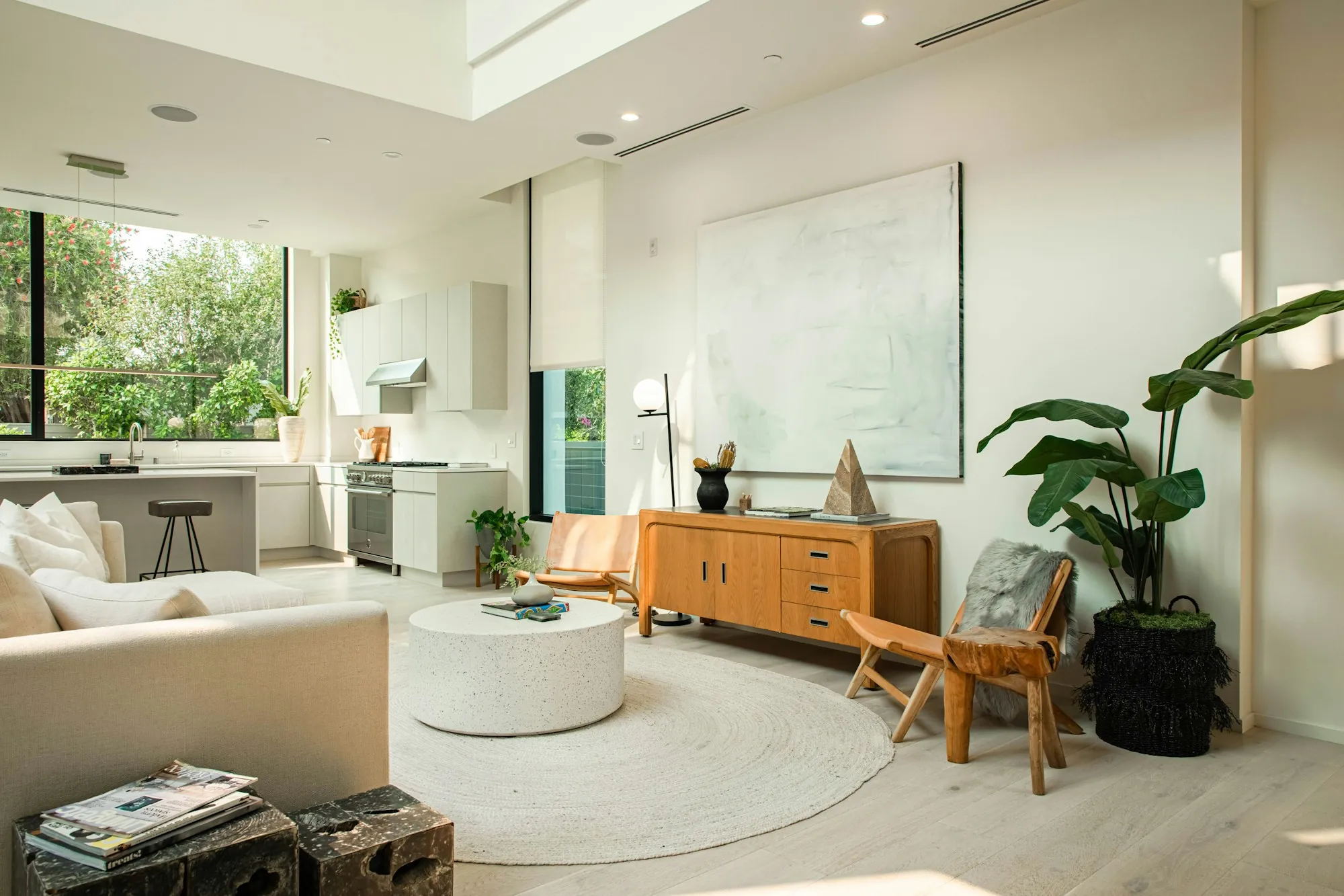 Open living room with a white sofa and a wooden console